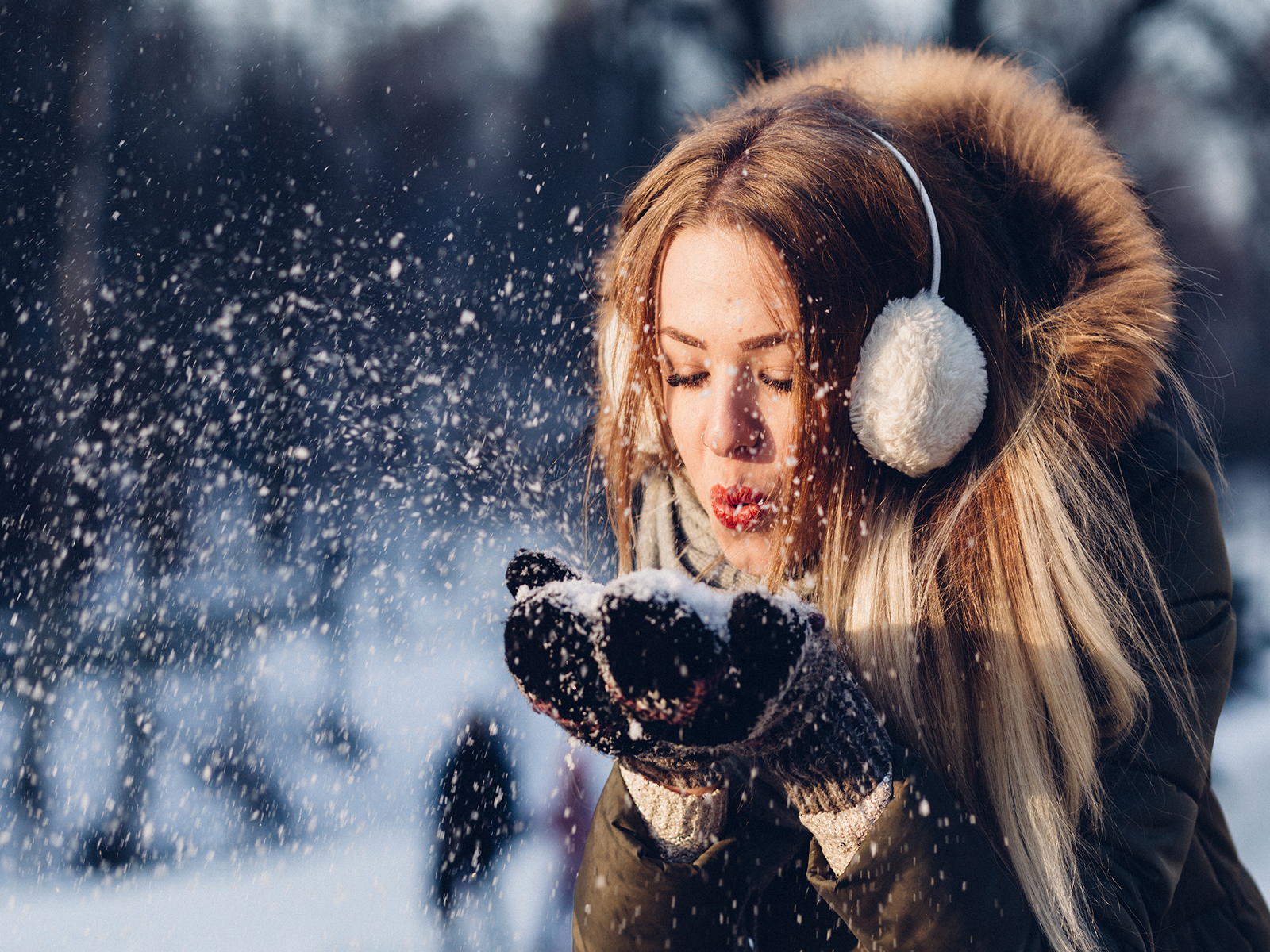 Woman enjoying in the snow