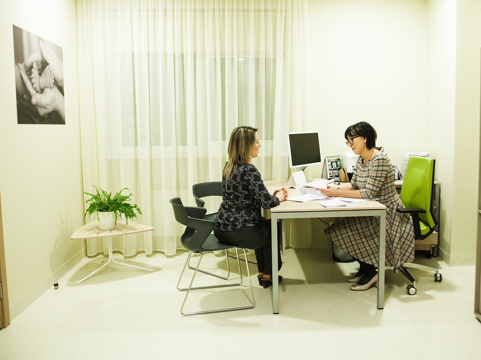 Doctor consulting a female patient in a medical office
